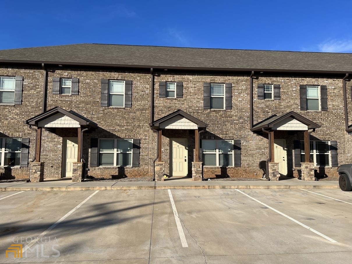 860 South Harkness Street, Unit G Jackson, GA 30233 - Photo 1 of 21 a view of a building with a street