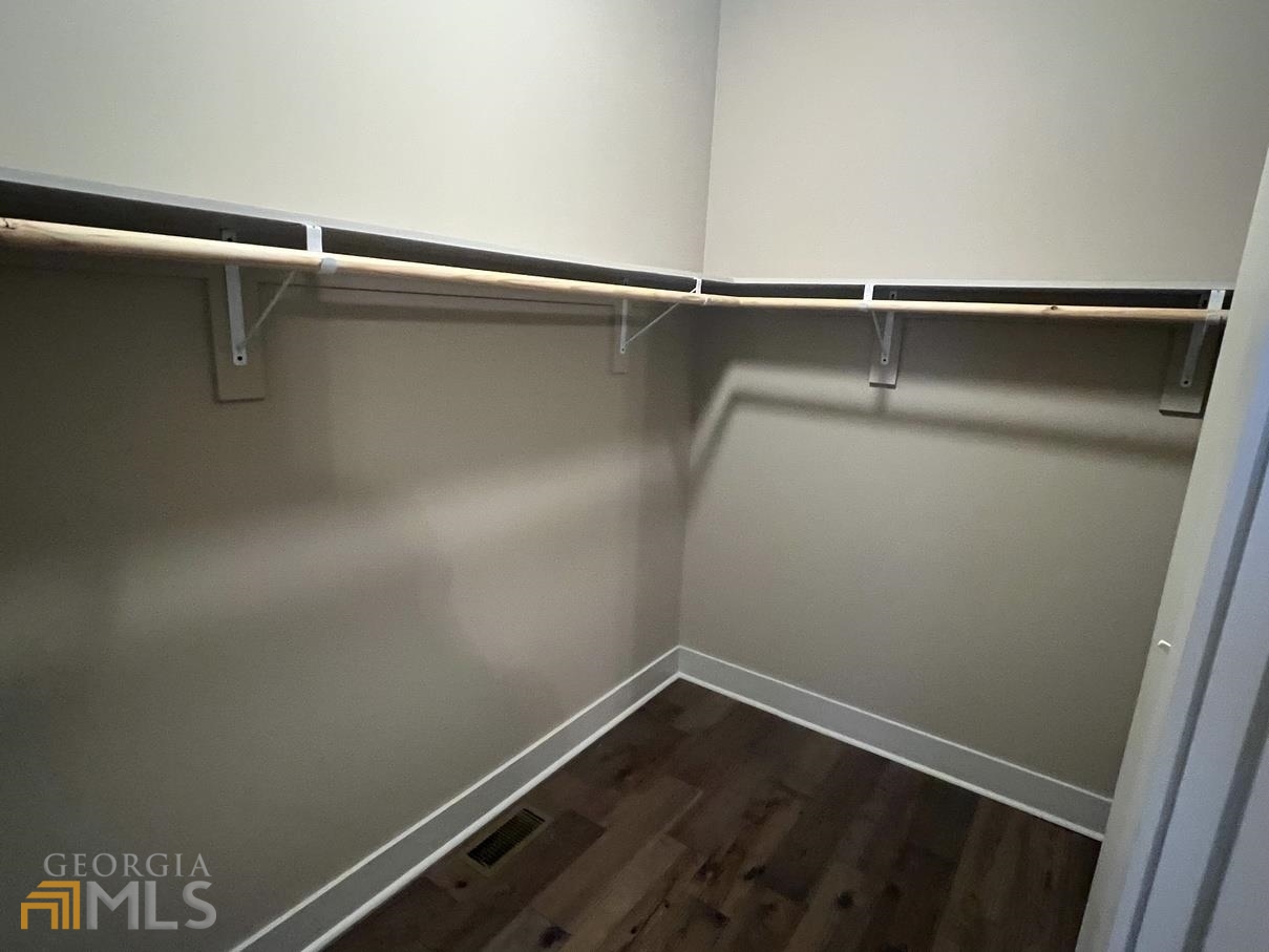 860 South Harkness Street, Unit G Jackson, GA 30233 - Photo 12 of 21 a view of a room with racks on the wall