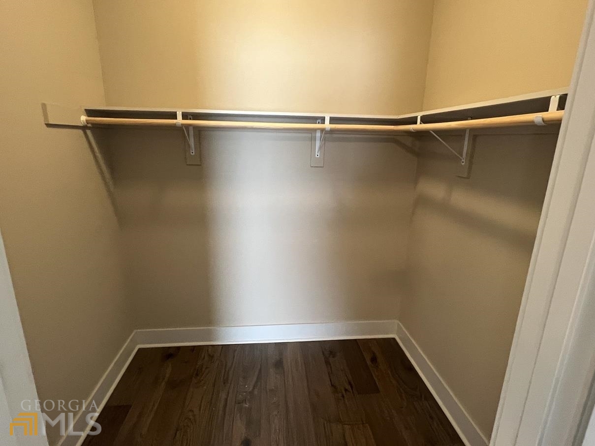 860 South Harkness Street, Unit G Jackson, GA 30233 - Photo 17 of 21 a view of a room with wooden floor