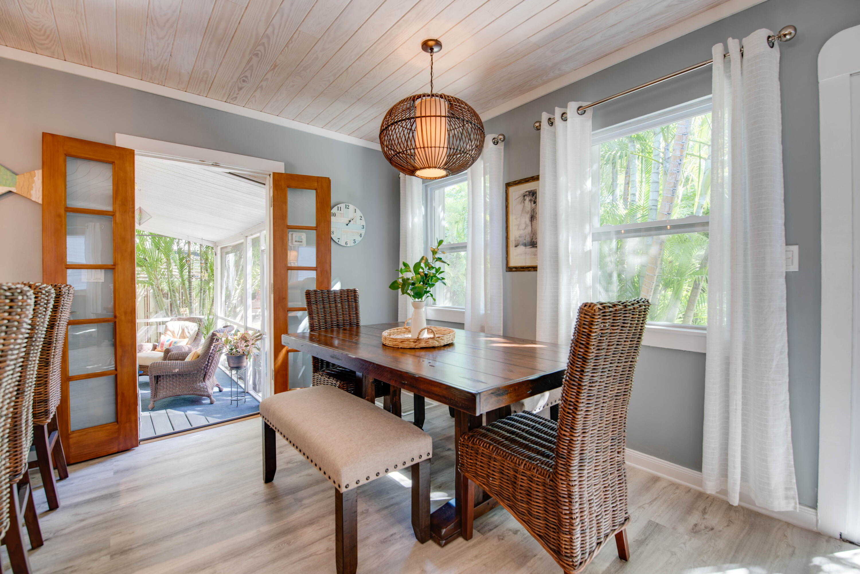 2828 Harris Avenue Key West, FL 33040 - Photo 20 of 45 a dining room with furniture wooden floor a rug a potted plant and a chandelier