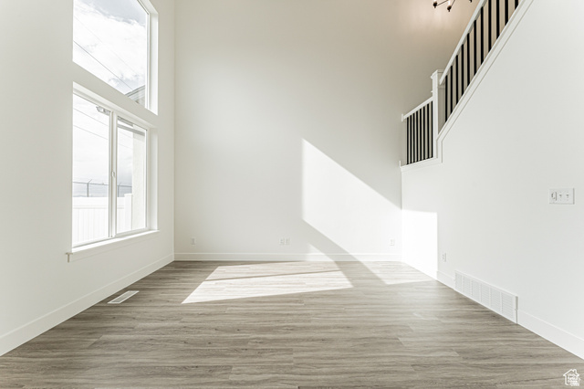 4774 Alder Drive Mapleton, UT 84664 - Photo 7 of 27 Empty room featuring a high ceiling and light wood-style flooring