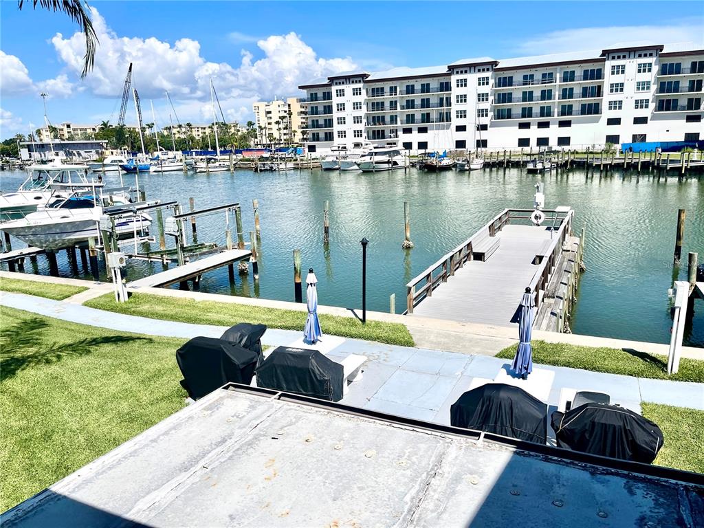 165 Medallion Boulevard, Unit H Madeira Beach, FL 33708 - Photo 5 of 20 a view of a lake with a house