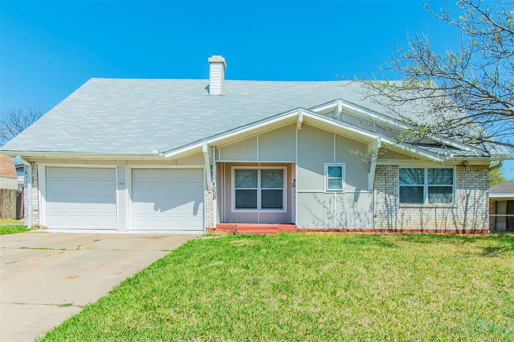4009 Finley Road Irving, TX 75062 - Photo 1 of 1 a front view of a house with a yard and porch