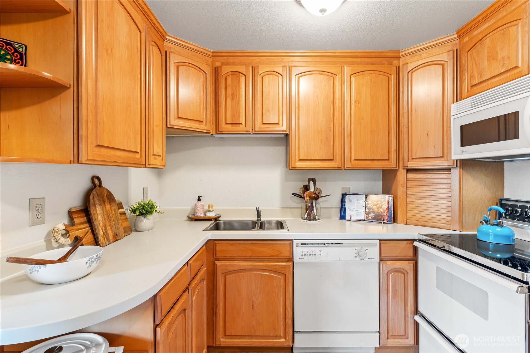 2619 Rucker Avenue, Unit 2 Everett, WA 98201 - Photo 10 of 33 a kitchen with stainless steel appliances granite countertop a sink a stove and cabinets