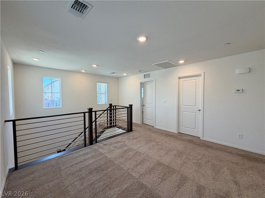 3624 Bitonto Lane Henderson, NV 89044 - Photo 12 of 28 This spacious loft area features comfortable carpeting, recessed lighting, and a contemporary railing leading to the lower level.
