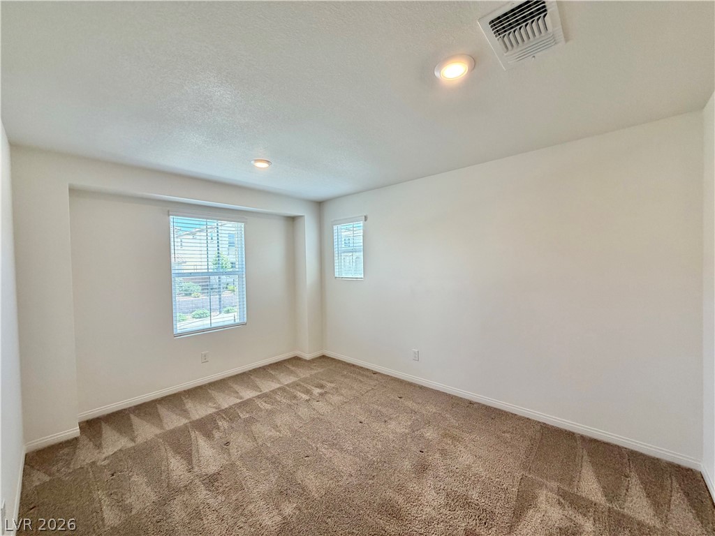 3624 Bitonto Lane Henderson, NV 89044 - Photo 21 of 28 This inviting room offers ample space, warm natural light, and plush carpeting.