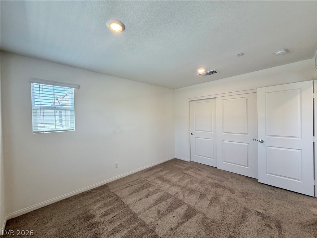 3624 Bitonto Lane Henderson, NV 89044 - Photo 22 of 28 This cozy bedroom features plush carpeting and convenient closet space, ready for your personal touch.