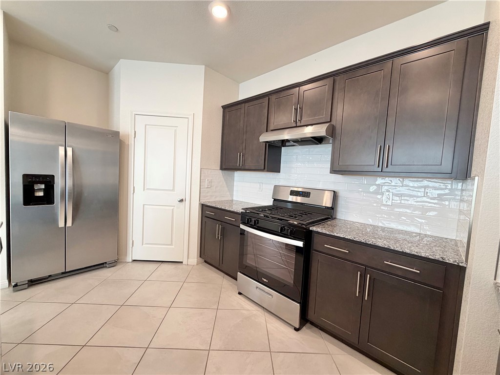 3624 Bitonto Lane Henderson, NV 89044 - Photo 6 of 28 This modern kitchen features sleek appliances and ample cabinet space, perfect for culinary endeavors.