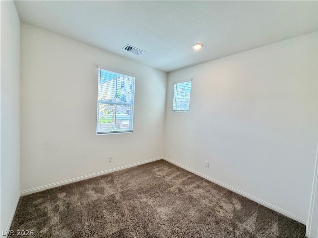 3624 Bitonto Lane Henderson, NV 89044 - Photo 8 of 28 Bright and airy room with inviting carpeted flooring and natural light.
