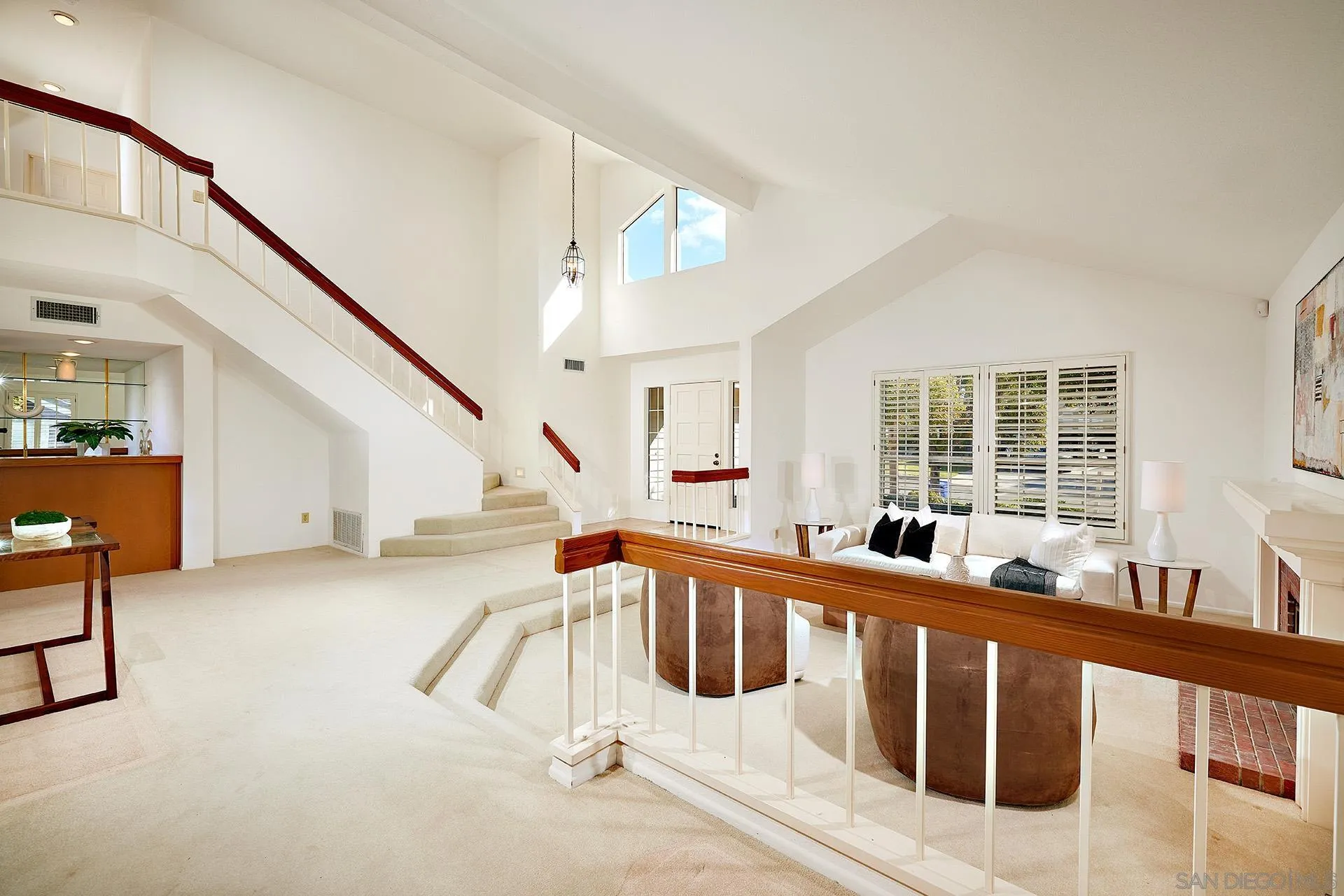 12490 Rue Cheaumont San Diego, CA 92131 - Photo 22 of 58 a view of an entryway with wooden floor and windows