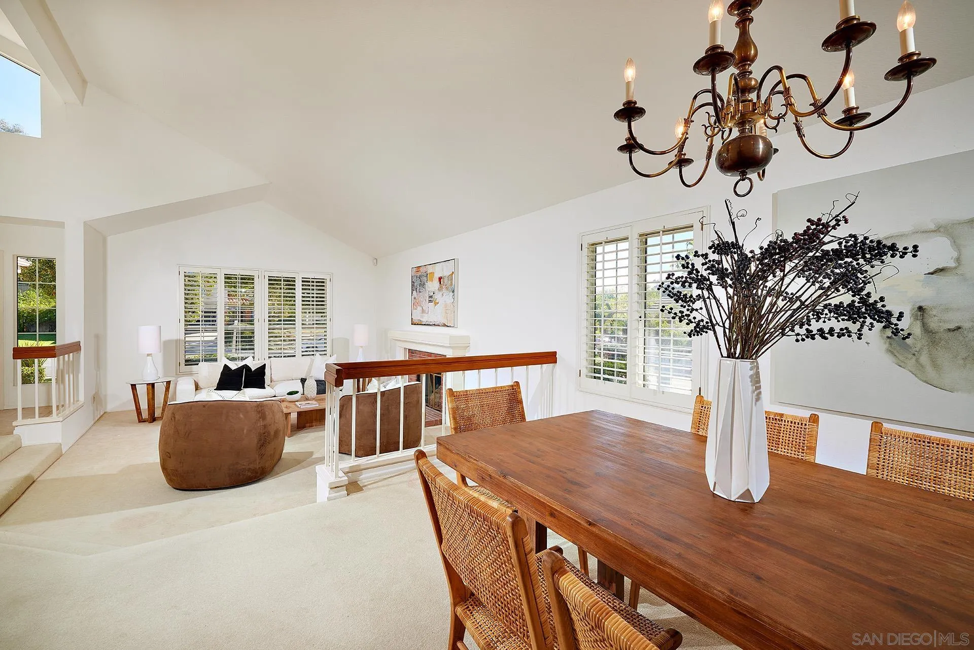 12490 Rue Cheaumont San Diego, CA 92131 - Photo 23 of 58 a living room with furniture a potted plant and a chandelier