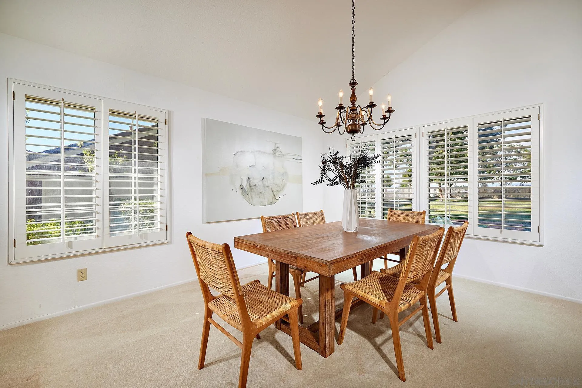 12490 Rue Cheaumont San Diego, CA 92131 - Photo 24 of 58 a dining room with furniture a chandelier and window