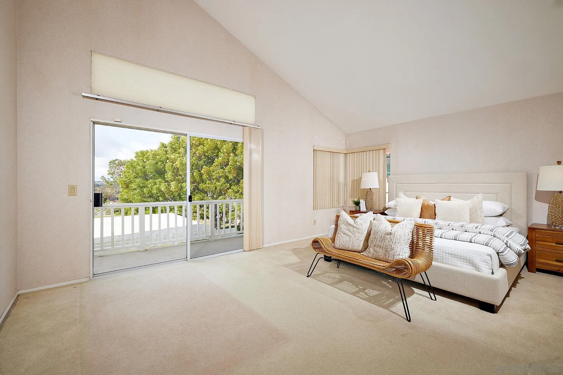 12490 Rue Cheaumont San Diego, CA 92131 - Photo 34 of 58 a spacious bedroom with a bed and a large window