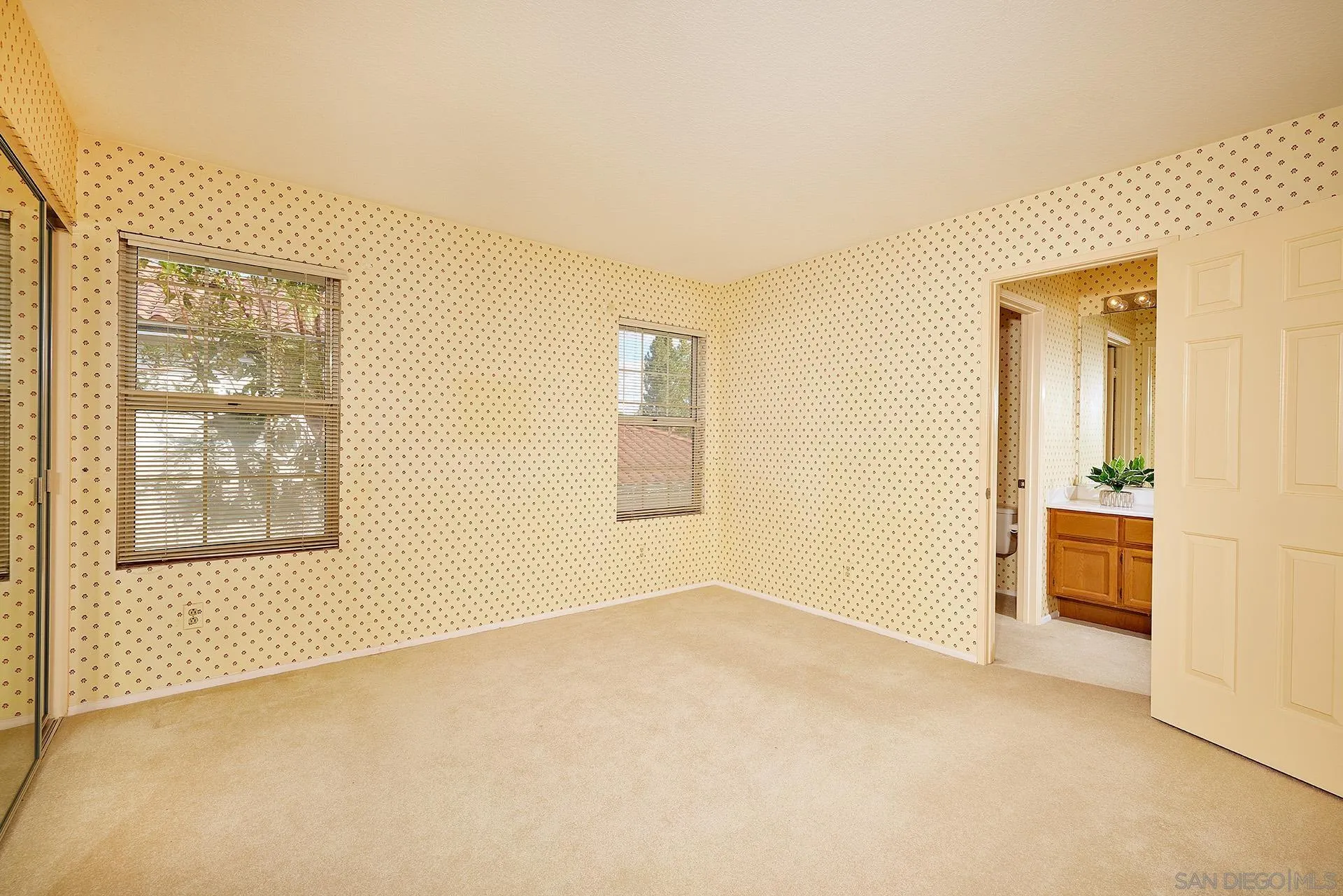 12490 Rue Cheaumont San Diego, CA 92131 - Photo 36 of 58 an empty room with windows and closet