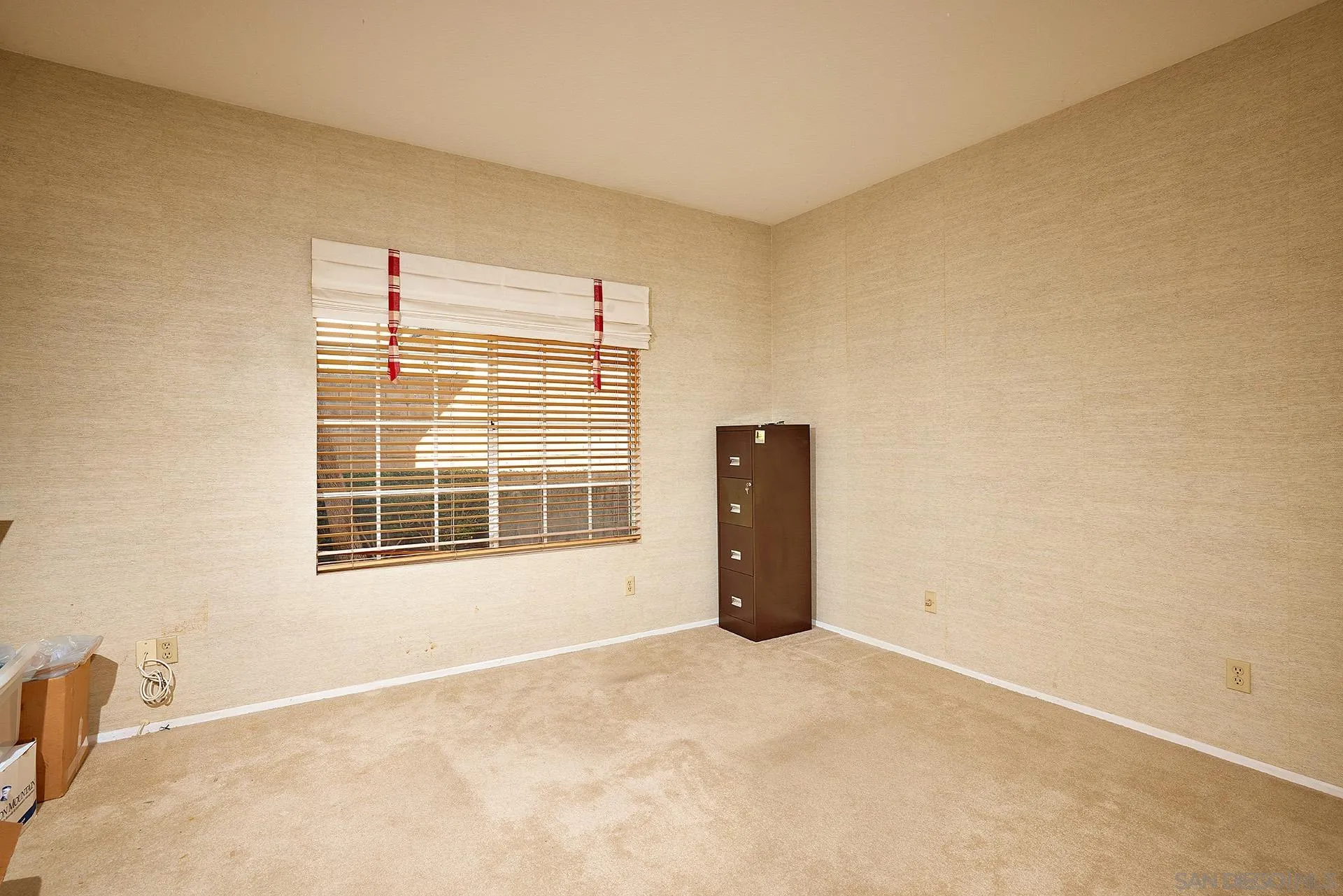 12490 Rue Cheaumont San Diego, CA 92131 - Photo 38 of 58 a view of an empty room with a window
