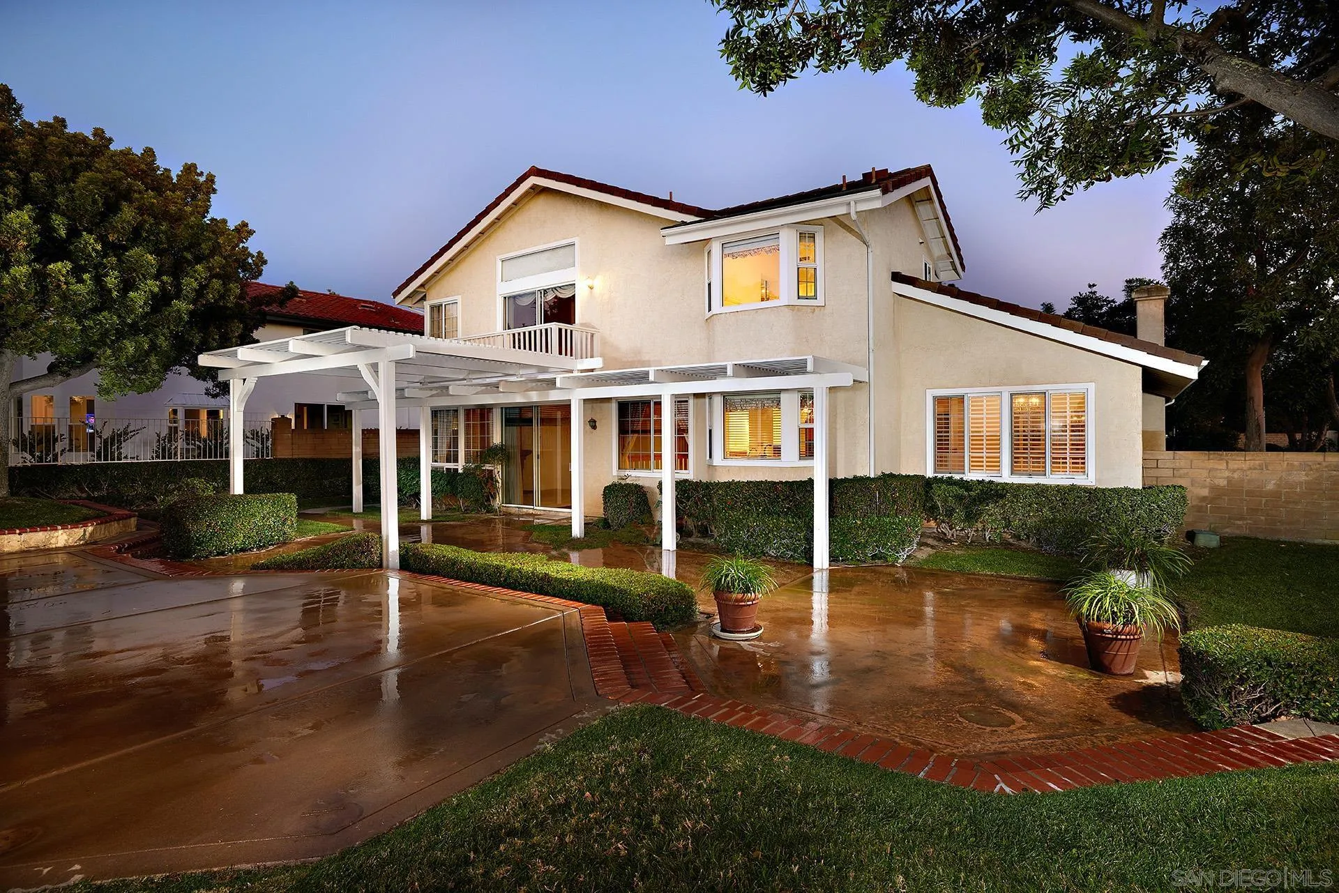 12490 Rue Cheaumont San Diego, CA 92131 - Photo 4 of 58 a front view of a house with a yard