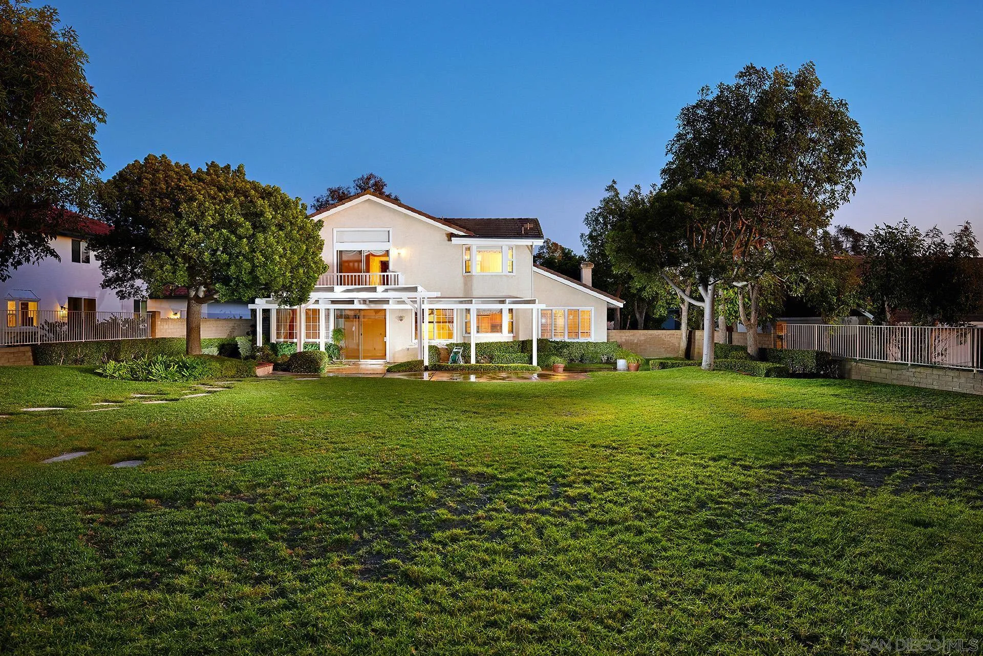 12490 Rue Cheaumont San Diego, CA 92131 - Photo 5 of 58 a front view of a house with garden
