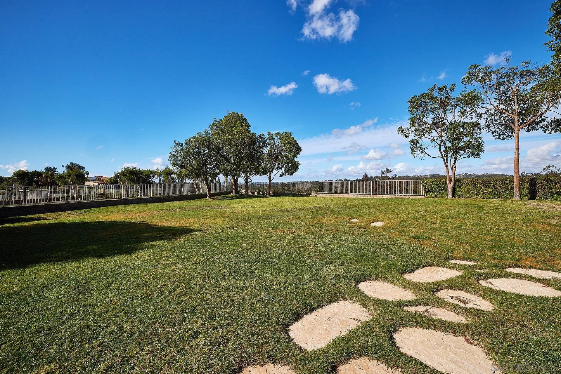 12490 Rue Cheaumont San Diego, CA 92131 - Photo 53 of 58 a view of a lake with a big yard