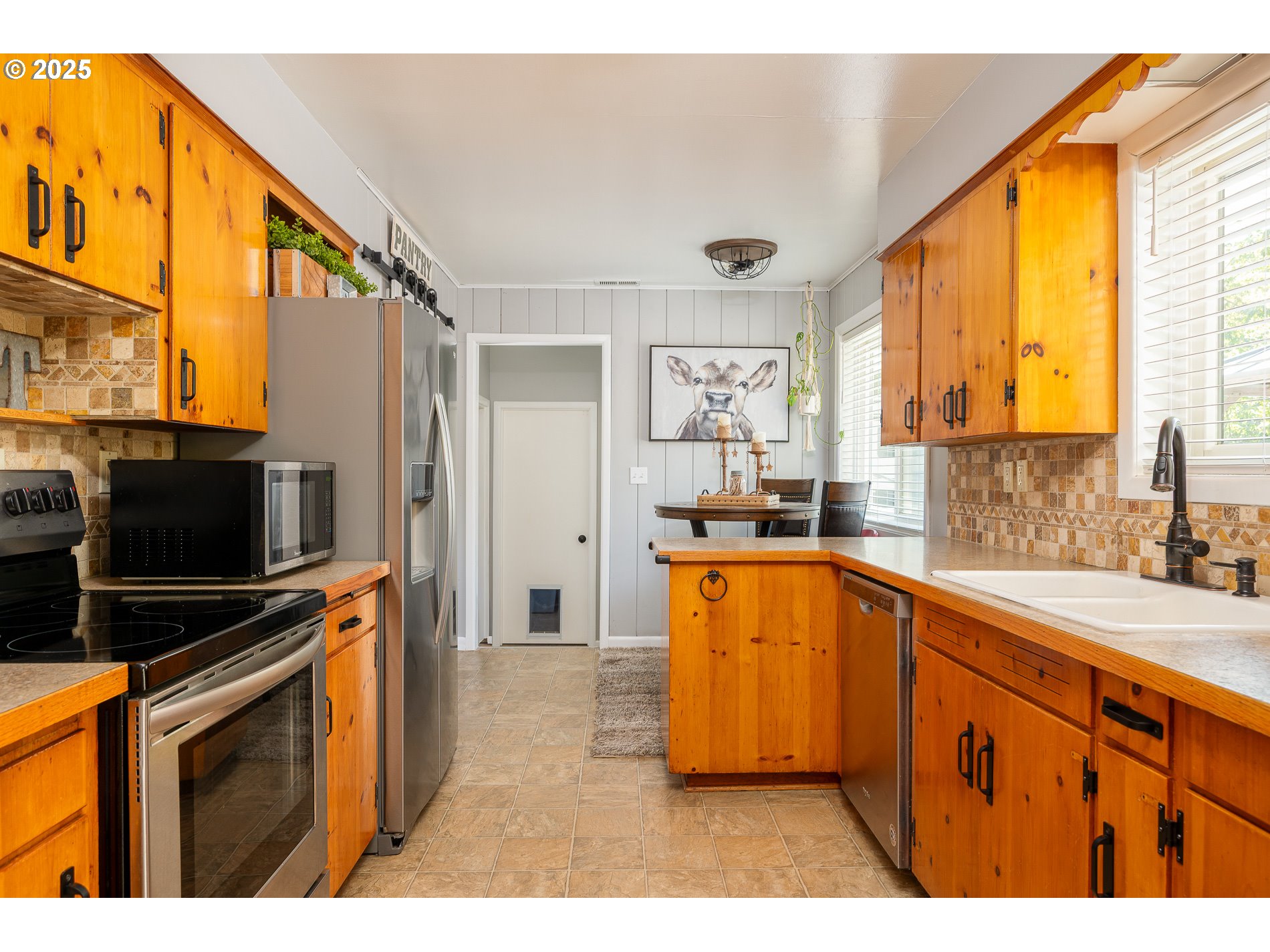 23636 Highway 224 Boring, OR 97009 - Photo 16 of 48 a kitchen with stainless steel appliances granite countertop a stove a sink and a microwave