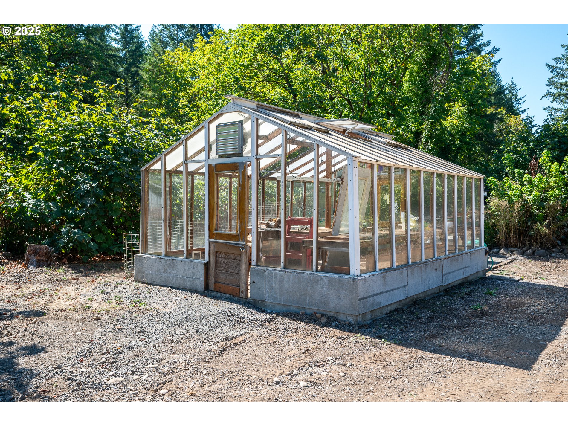 23636 Highway 224 Boring, OR 97009 - Photo 40 of 48 a view of a small yard in front of a house with a small garden