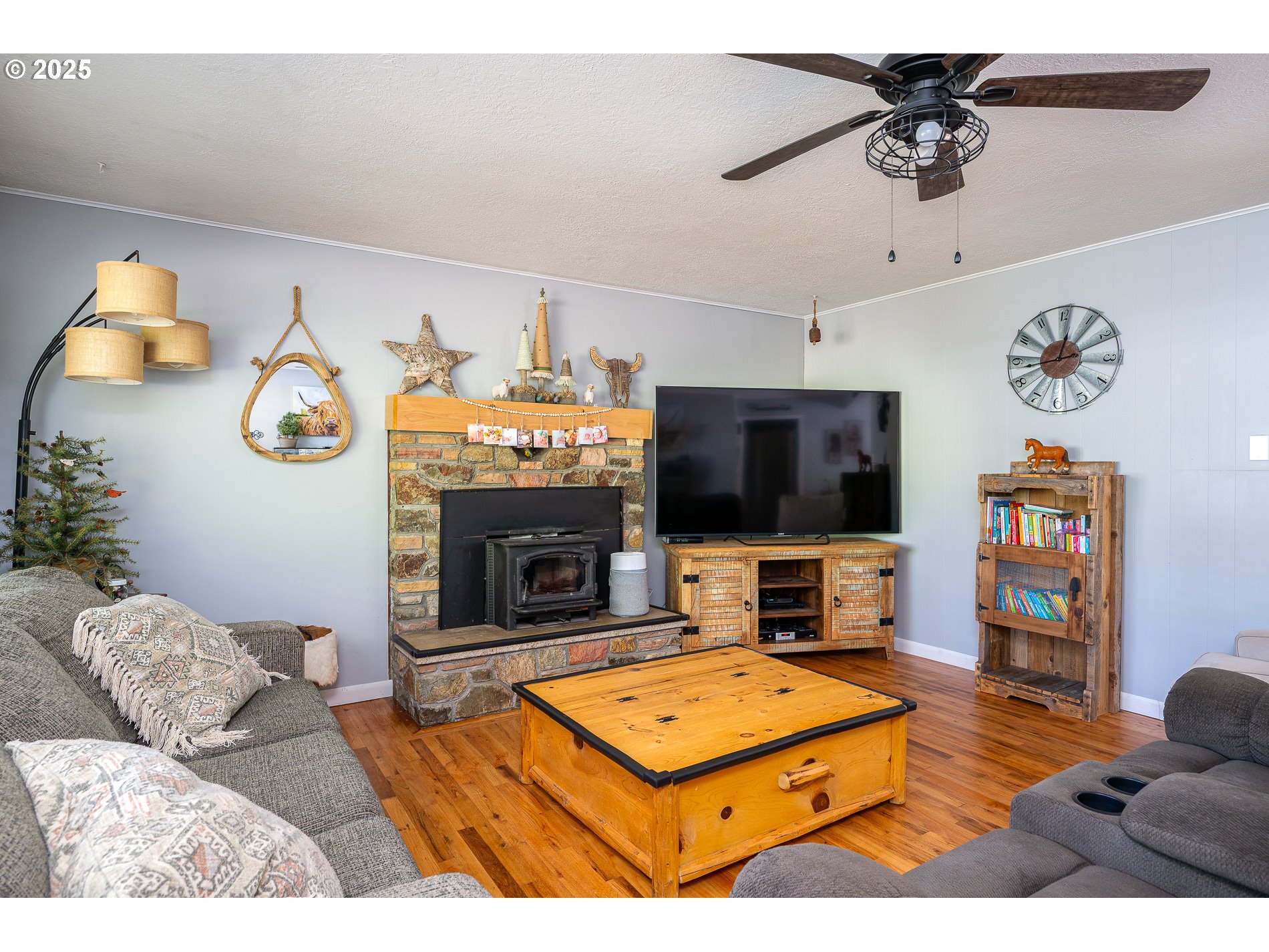 23636 Highway 224 Boring, OR 97009 - Photo 8 of 48 a living room with furniture and a flat screen tv