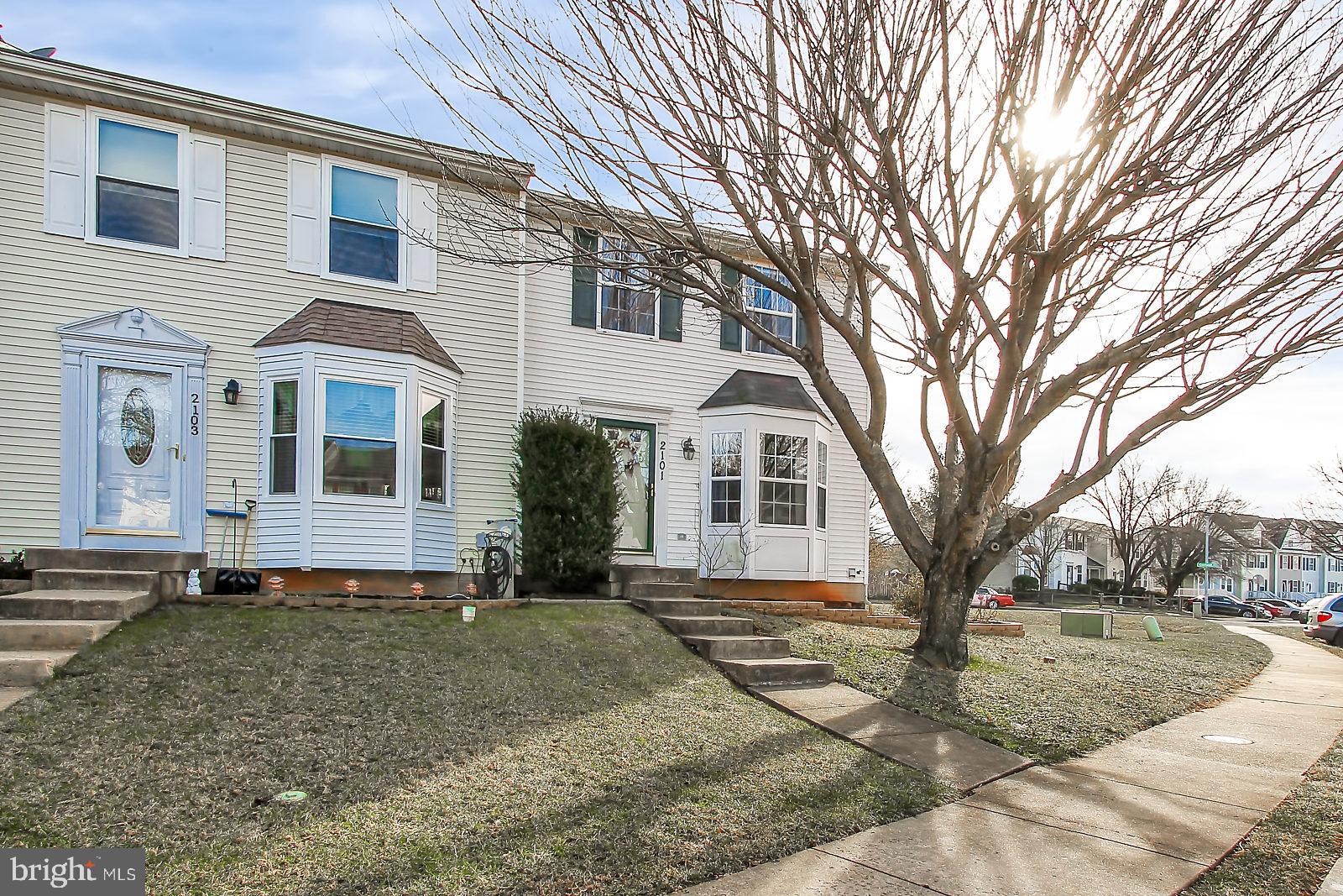2101 Riding Crop Way Baltimore, MD 21244 - Photo 35 of 36 a front view of a house with a yard