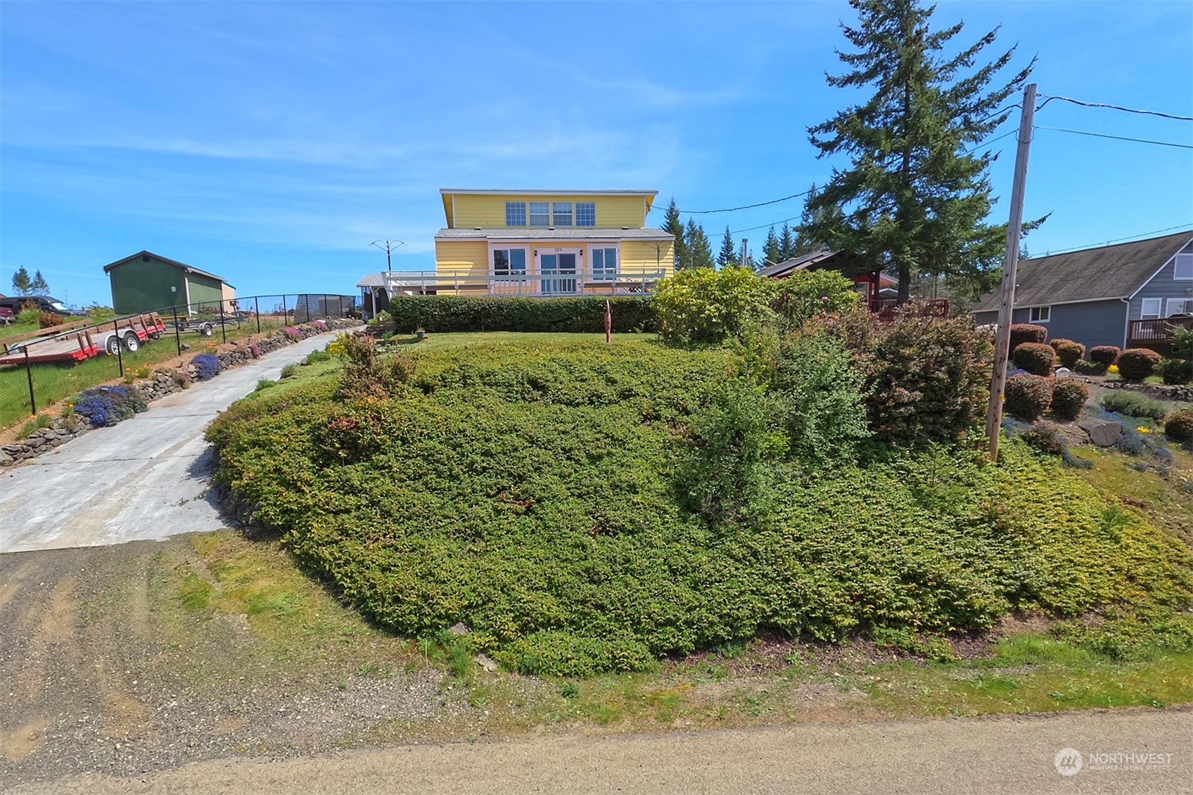 220 East Olympic Drive Grapeview, WA 98546 - Photo 1 of 40 a view of a back yard of the house