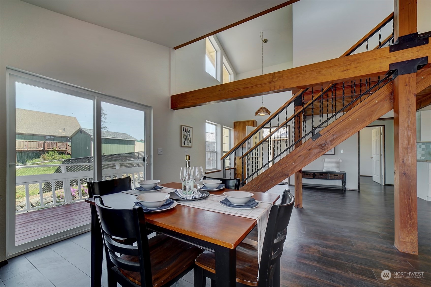 220 East Olympic Drive Grapeview, WA 98546 - Photo 12 of 40 a view of a dining room with furniture window and wooden floor
