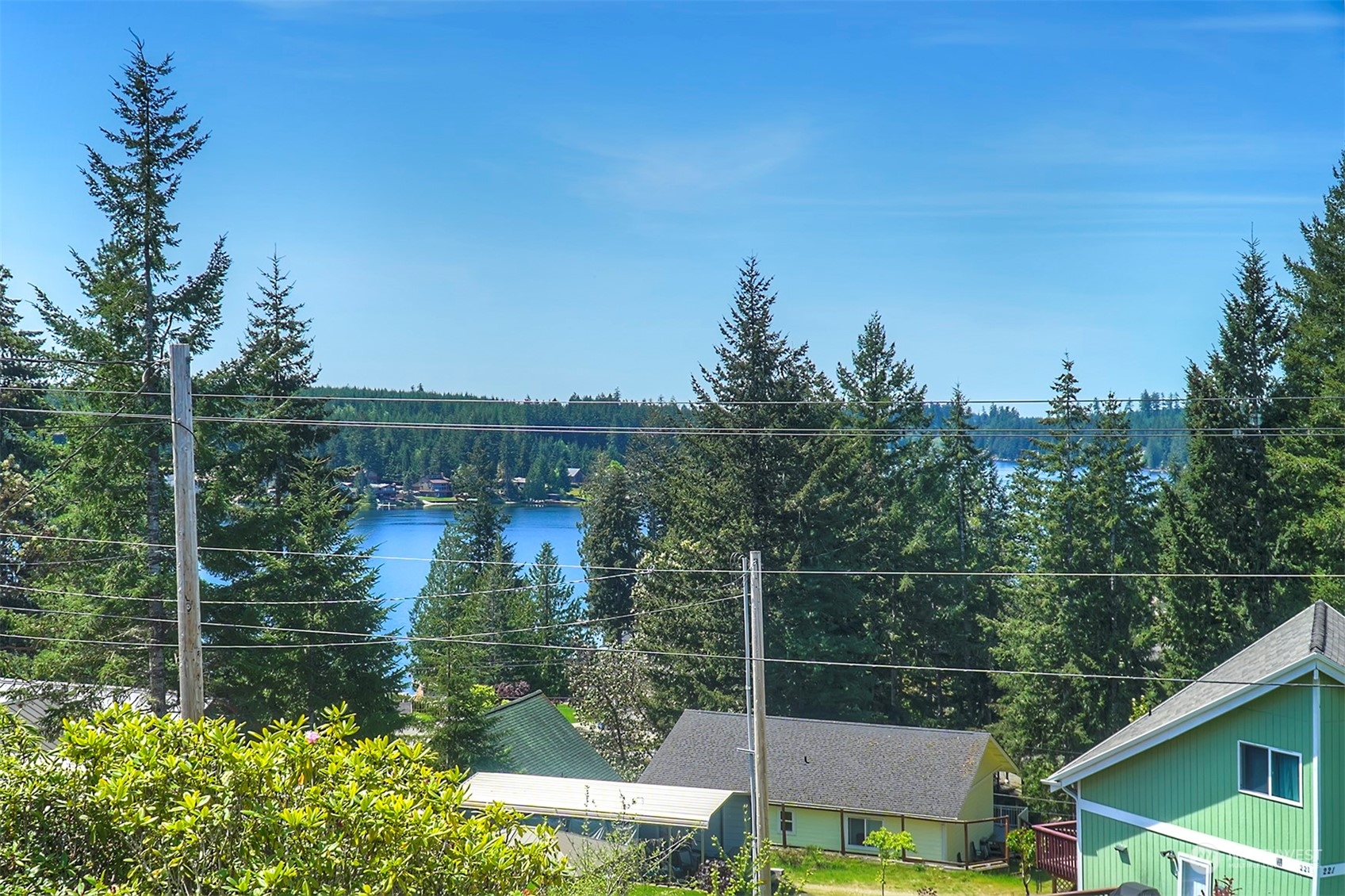 220 East Olympic Drive Grapeview, WA 98546 - Photo 2 of 40 a view of a lake from a balcony