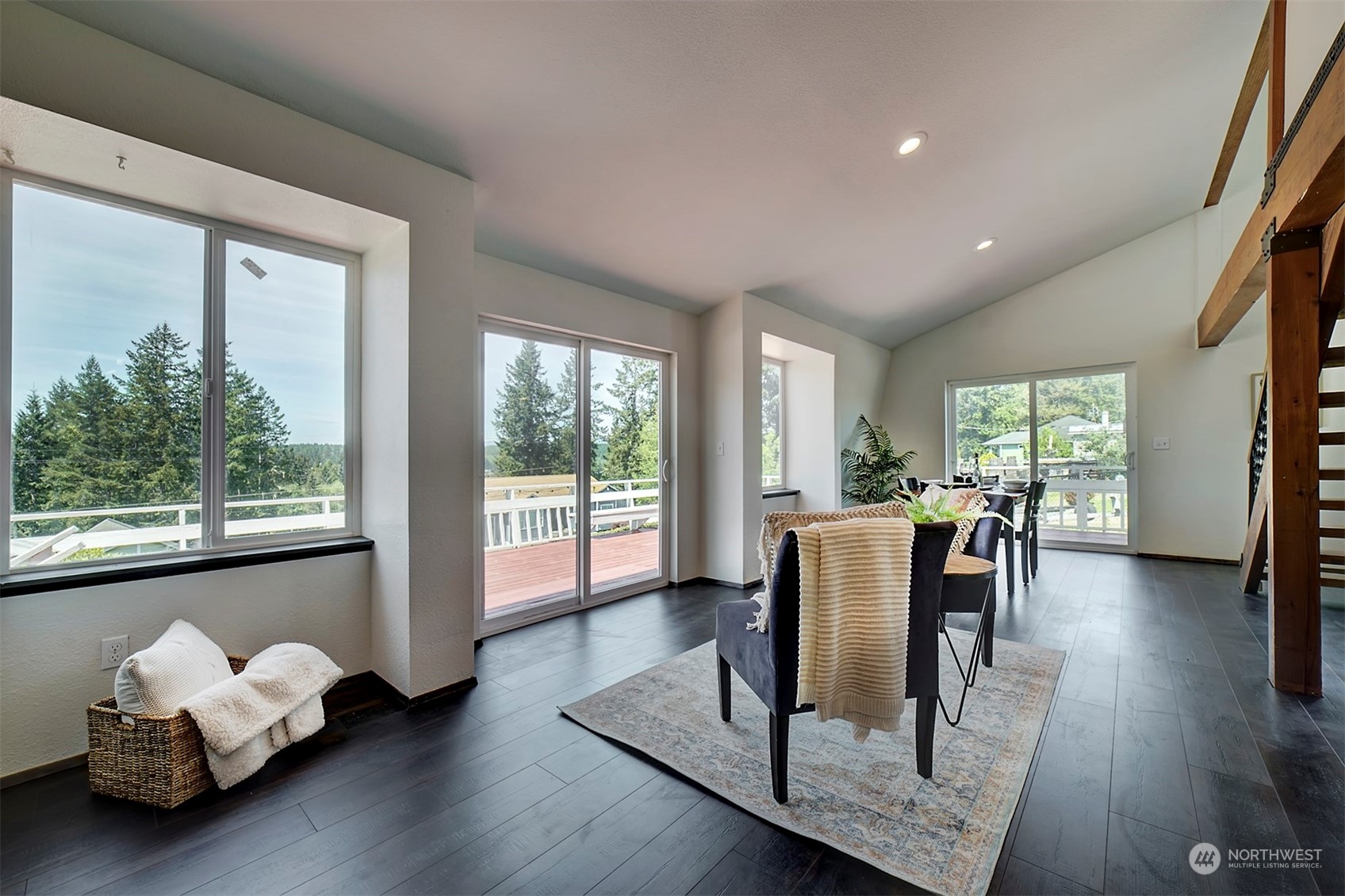 220 East Olympic Drive Grapeview, WA 98546 - Photo 23 of 40 a dining room with furniture and wooden floor