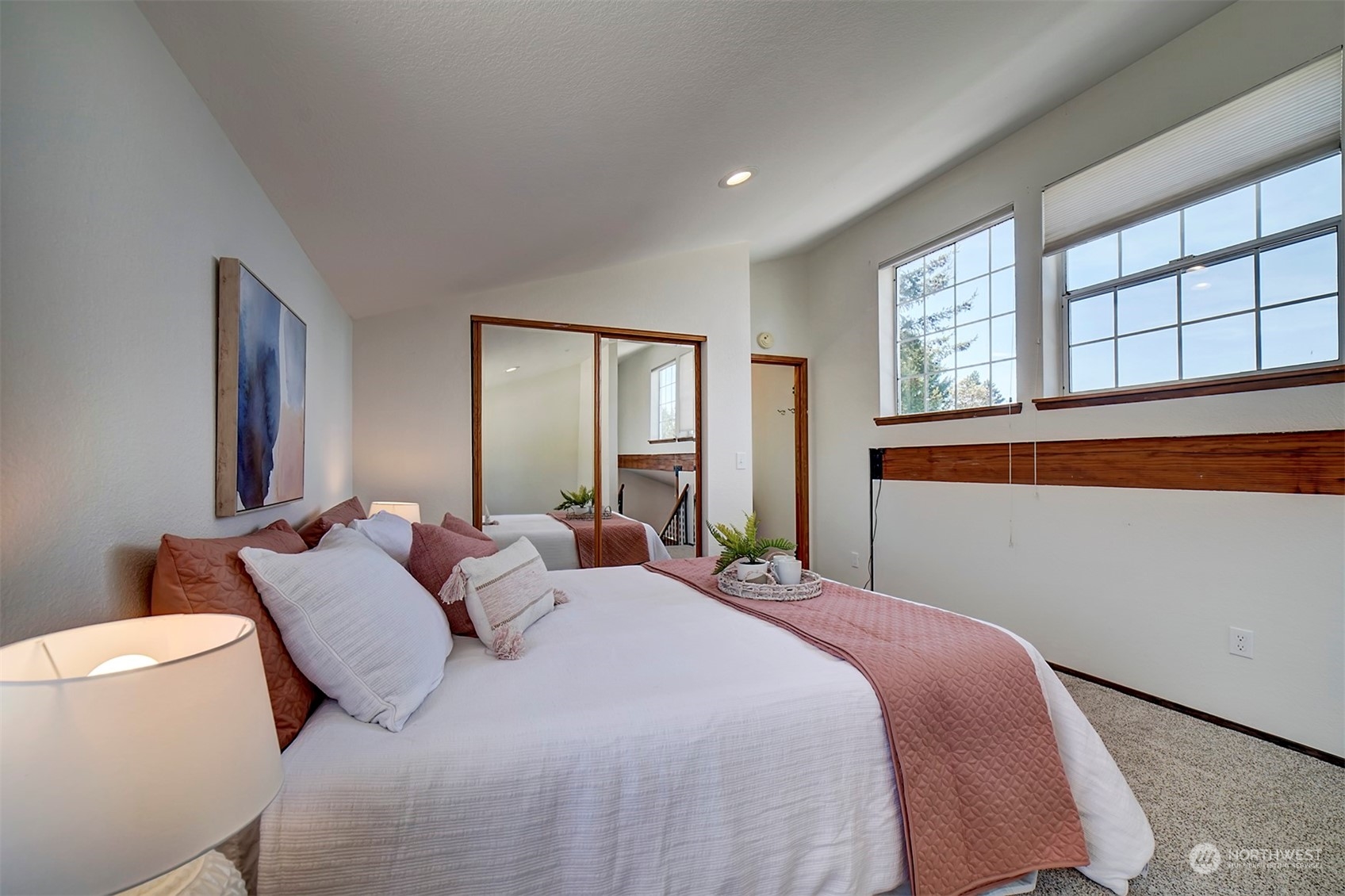 220 East Olympic Drive Grapeview, WA 98546 - Photo 27 of 40 a bedroom with a bed and a large window