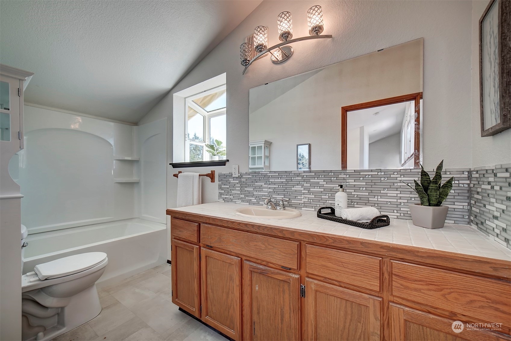 220 East Olympic Drive Grapeview, WA 98546 - Photo 28 of 40 a bathroom with a toilet a sink and bathtub