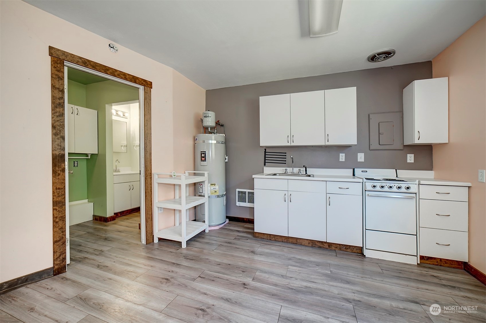 220 East Olympic Drive Grapeview, WA 98546 - Photo 31 of 40 a kitchen with white cabinets and white appliances