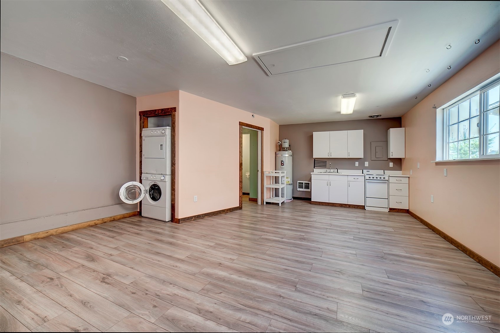 220 East Olympic Drive Grapeview, WA 98546 - Photo 33 of 40 a view of kitchen with wooden floor and window
