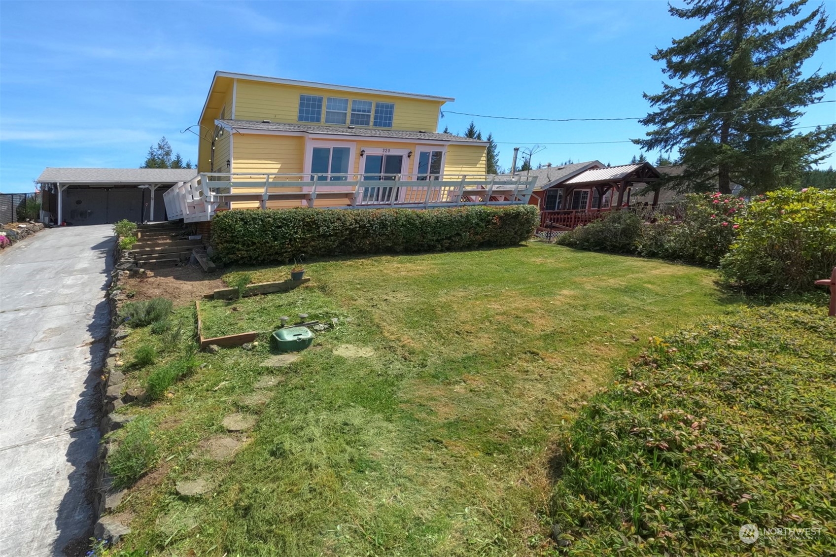 220 East Olympic Drive Grapeview, WA 98546 - Photo 5 of 40 a view of a house with a yard