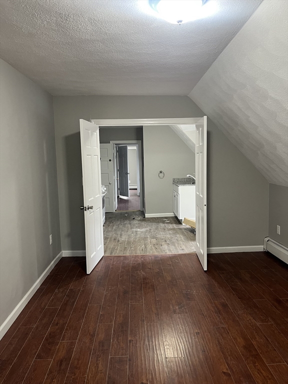 8 Wakefield Avenue, Unit 3R Wakefield, MA 01880 - Photo 3 of 7 a view of a room with wooden floor