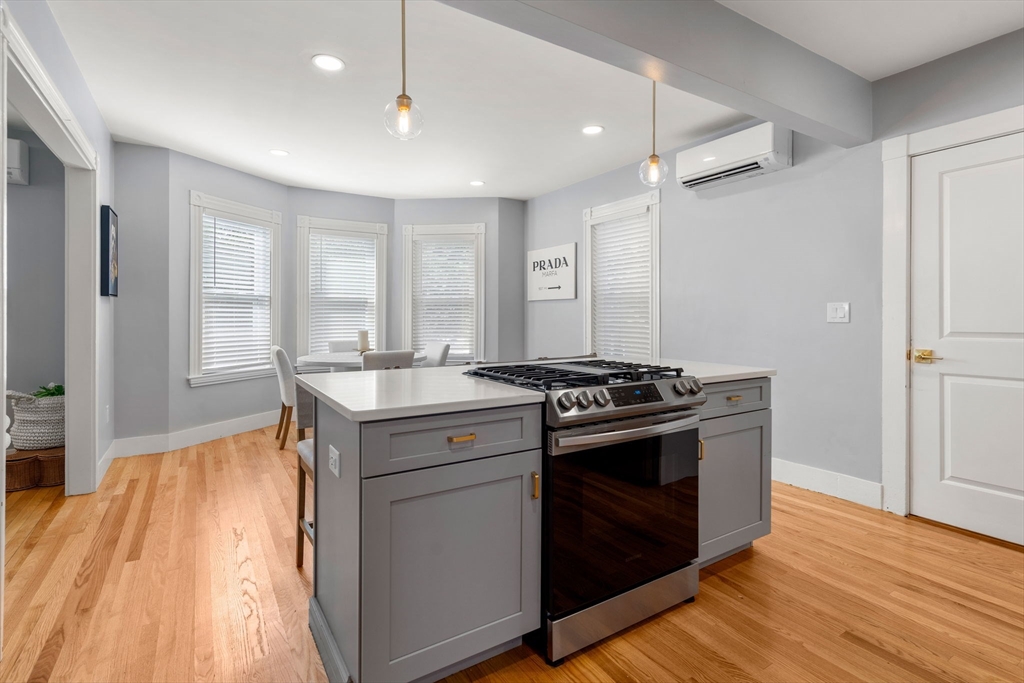 26 Clark Street Danvers, MA 01923 - Photo 13 of 42 a kitchen with a stove and a sink