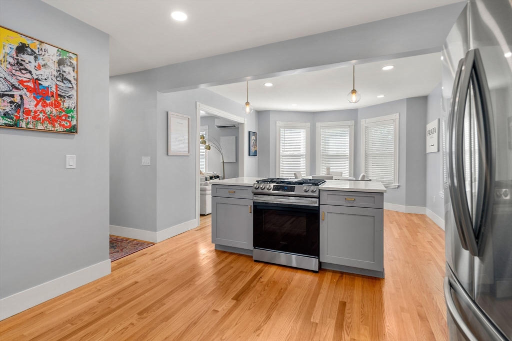 26 Clark Street Danvers, MA 01923 - Photo 16 of 42 a kitchen with stainless steel appliances granite countertop a refrigerator and a stove