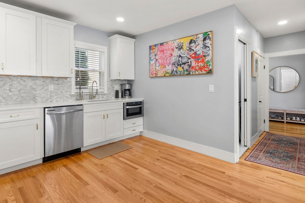 26 Clark Street Danvers, MA 01923 - Photo 17 of 42 a kitchen with a cabinets and wooden floor