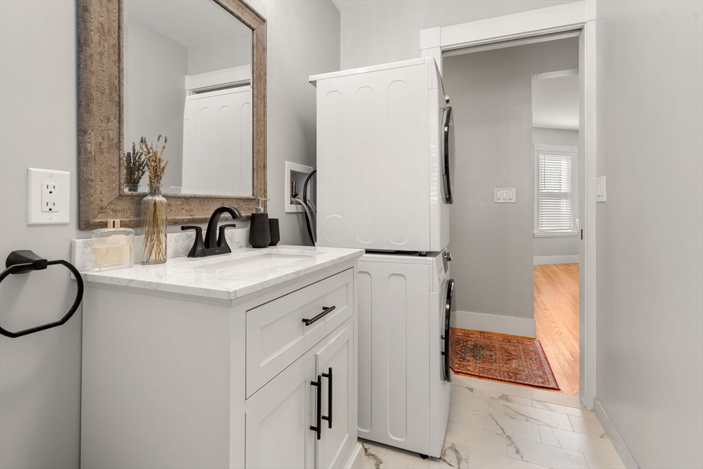 26 Clark Street Danvers, MA 01923 - Photo 19 of 42 a bathroom with a sink and a mirror