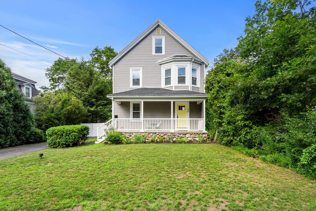 26 Clark Street Danvers, MA 01923 - Photo 2 of 42 a front view of a house with a yard