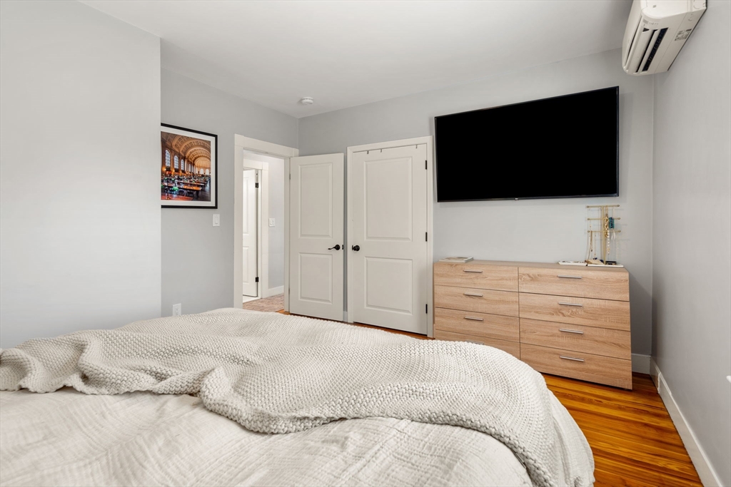 26 Clark Street Danvers, MA 01923 - Photo 24 of 42 a bedroom with a bed and a flat screen tv