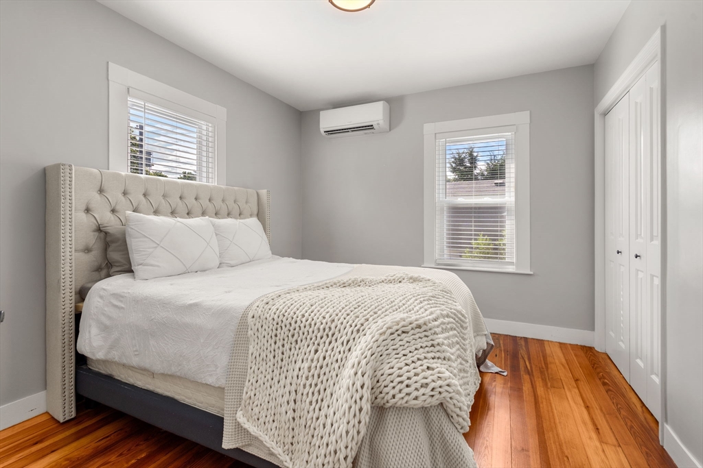 26 Clark Street Danvers, MA 01923 - Photo 26 of 42 a bedroom with a bed and wooden floor