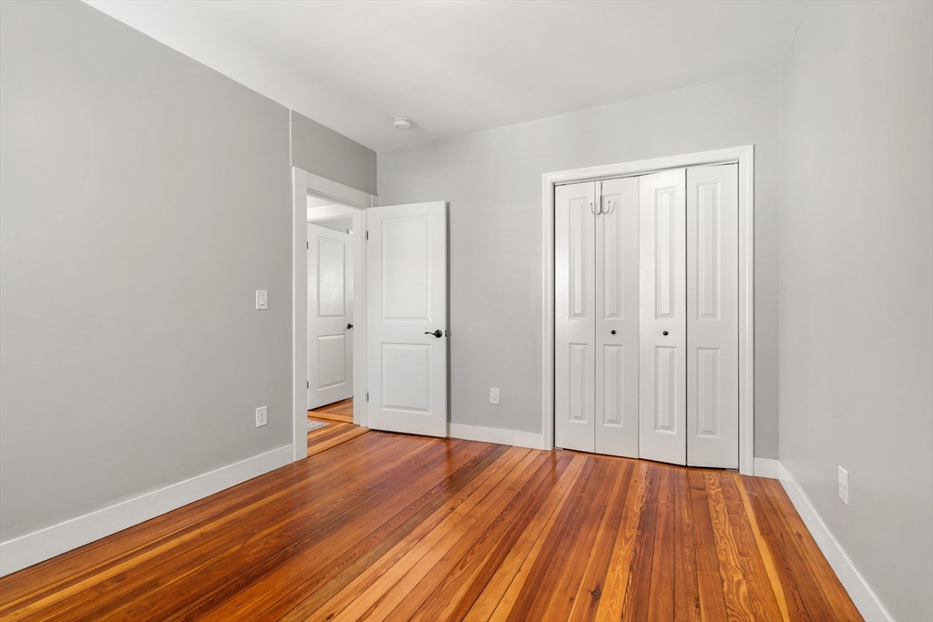 26 Clark Street Danvers, MA 01923 - Photo 30 of 42 a view of an empty room with wooden floor