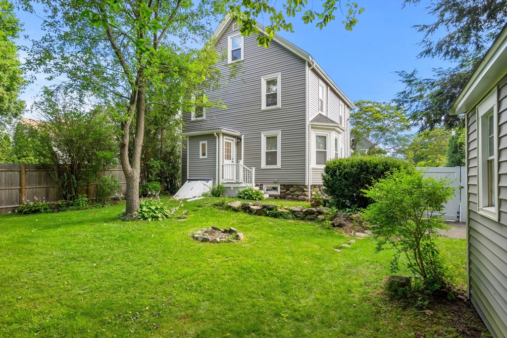26 Clark Street Danvers, MA 01923 - Photo 34 of 42 a front view of house with yard and green space