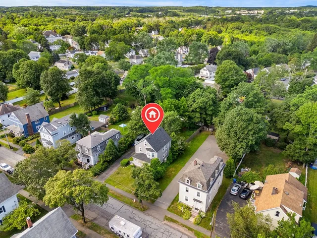 an aerial view of a red and white house