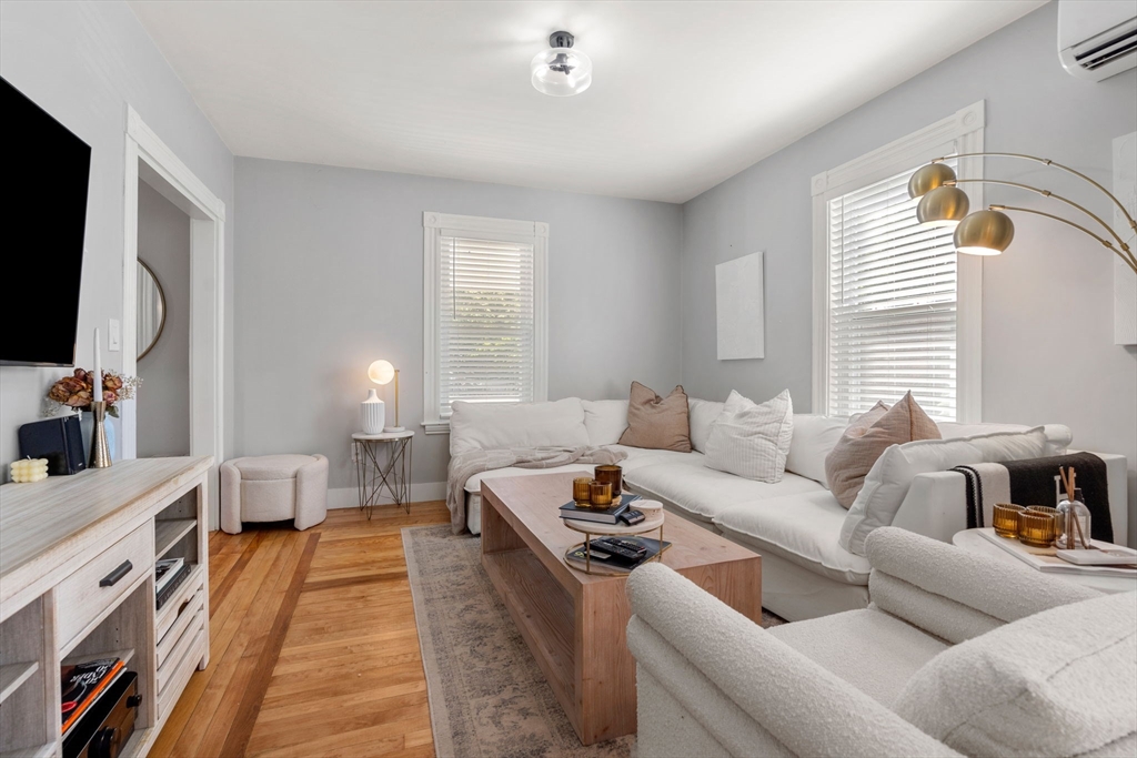 26 Clark Street Danvers, MA 01923 - Photo 5 of 42 a living room with furniture and a flat screen tv