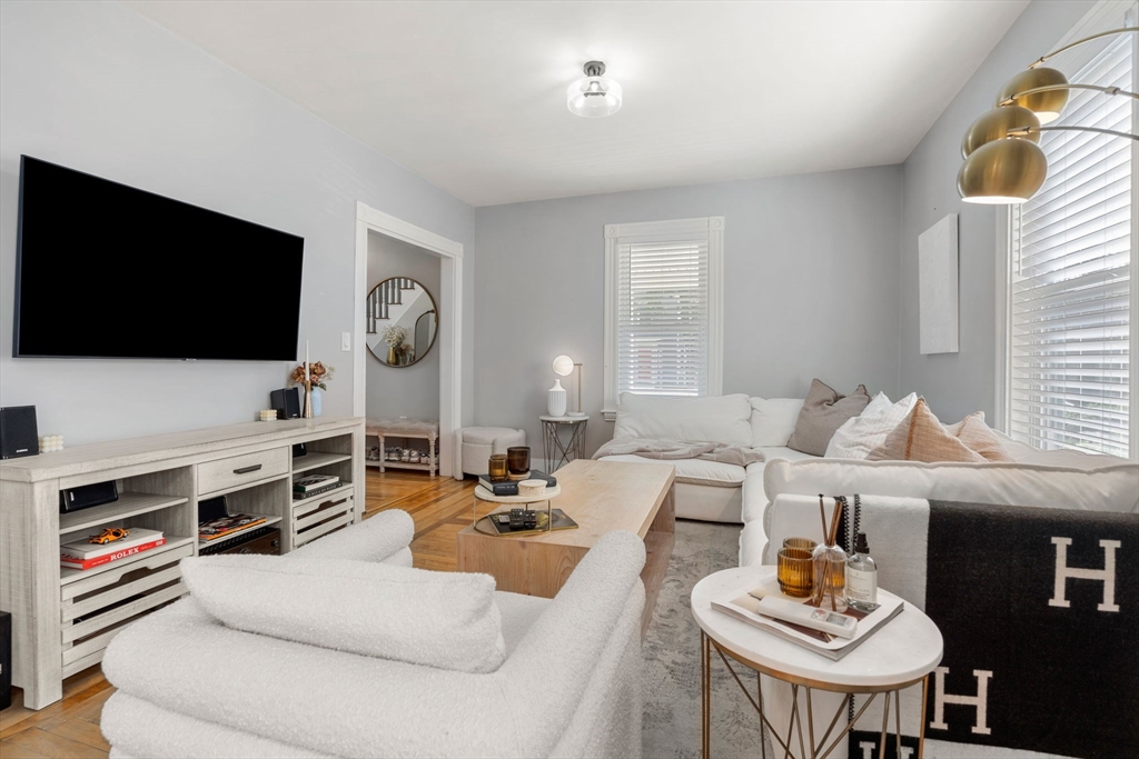 26 Clark Street Danvers, MA 01923 - Photo 6 of 42 a living room with furniture and a flat screen tv