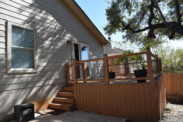 a view of a backyard with sitting area