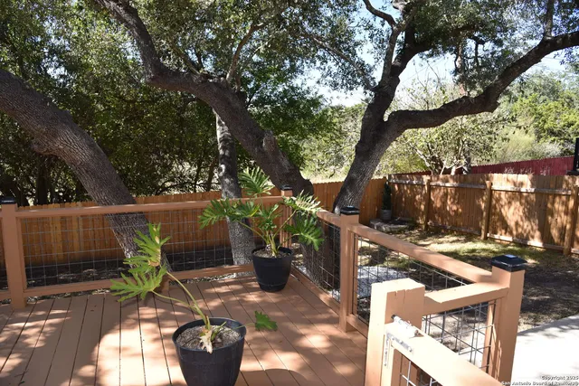 a view of a swimming pool with a patio and a garden